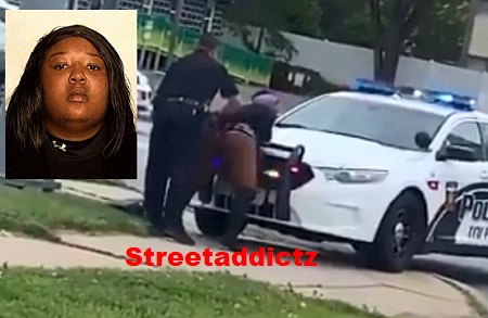 Woman keeps twerking even while getting arrested for pole dancing in the street.