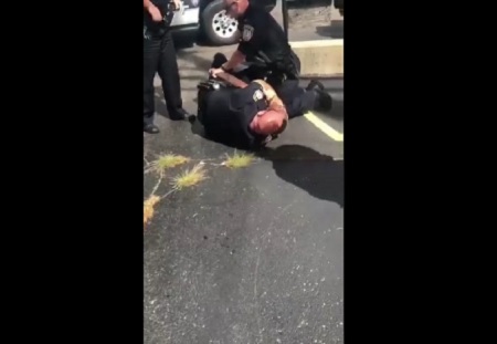 Dekalb IL Cop Under investigation after video show officer choking man.