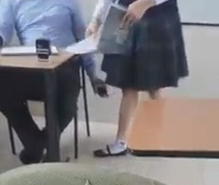 Teacher caught filming under students skirt.