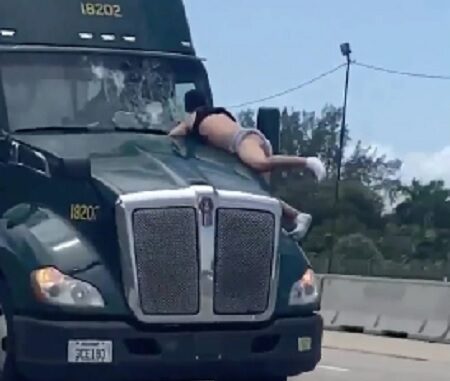 Florida Man Hangs On To Moving Semi-Truck Hood For Miles.