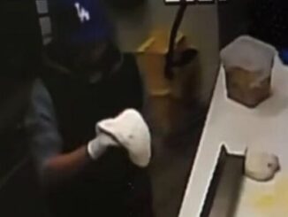 Man makes himself a pizza during robbery at restaurant.